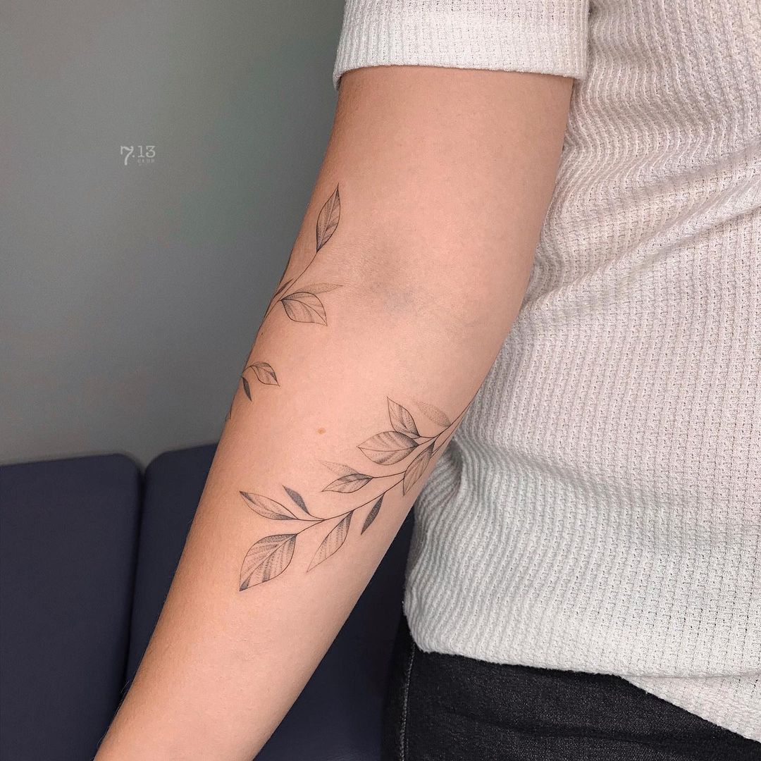 Spiritual Symbolism in Arm Wrap Tattoo