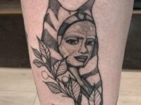 19-Black-Color-Inked-Ahsoka-face-with-Leaves-Tattoo-on-Lower-Leg