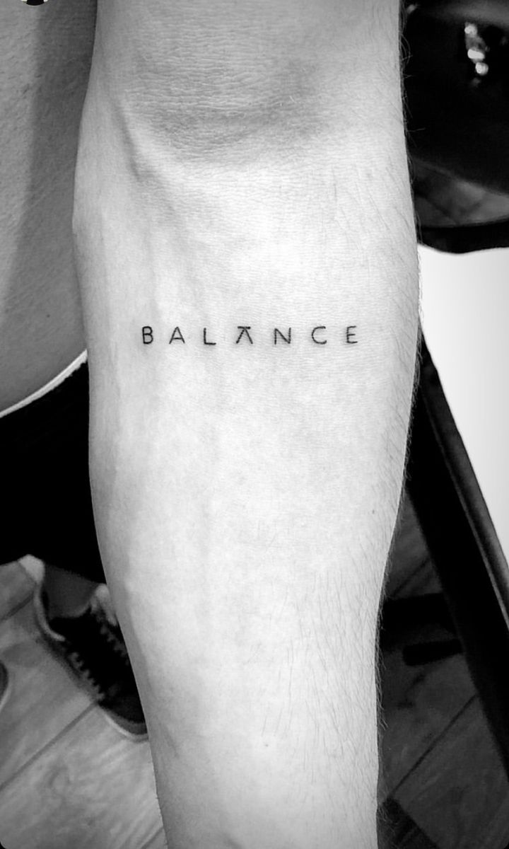 Small tattoo man symbolizing balance