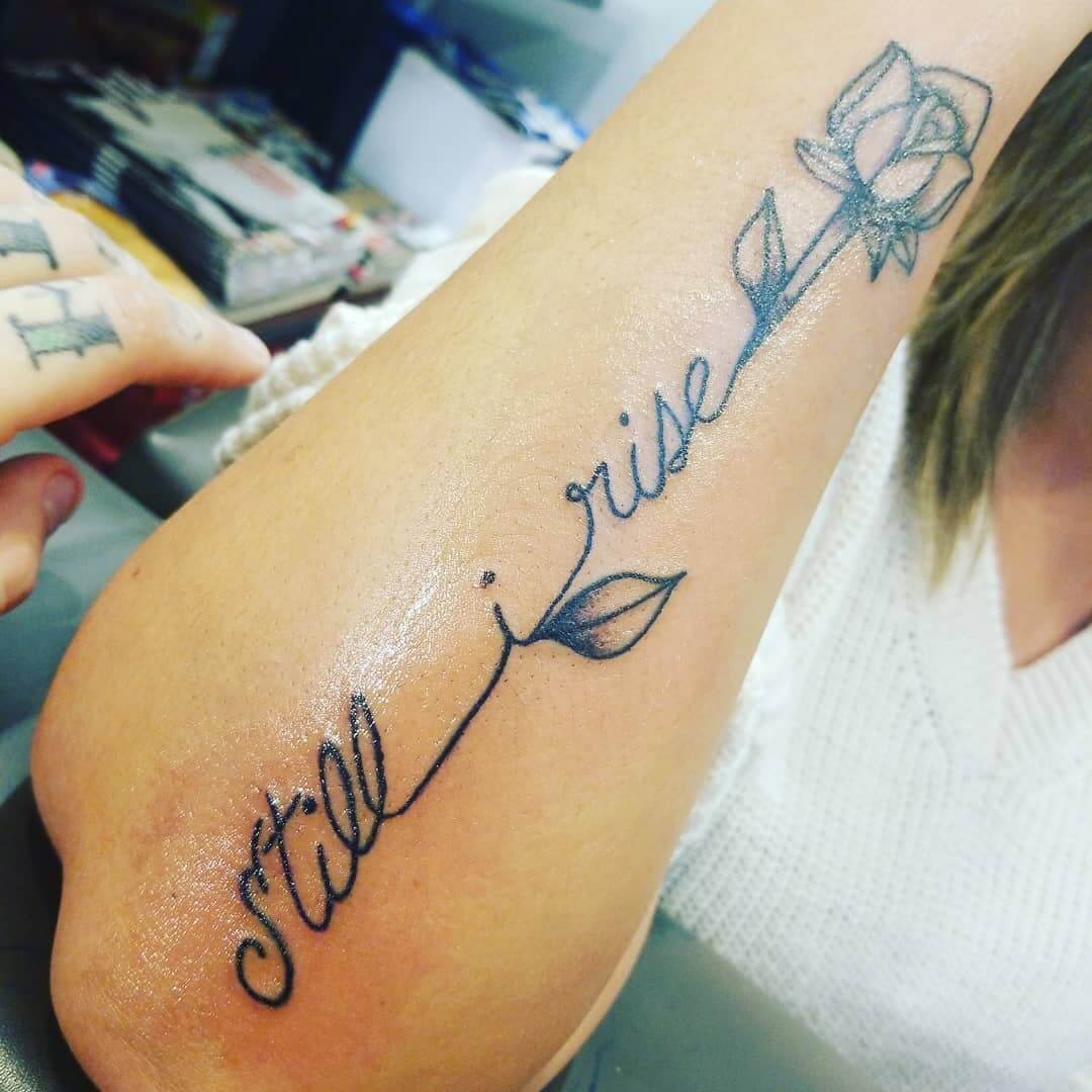 Inspirational Script Still I Rise Tattoo