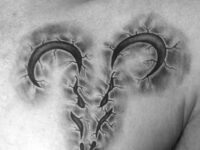 3d-stone-aries-mens-upper-chest-tattoos