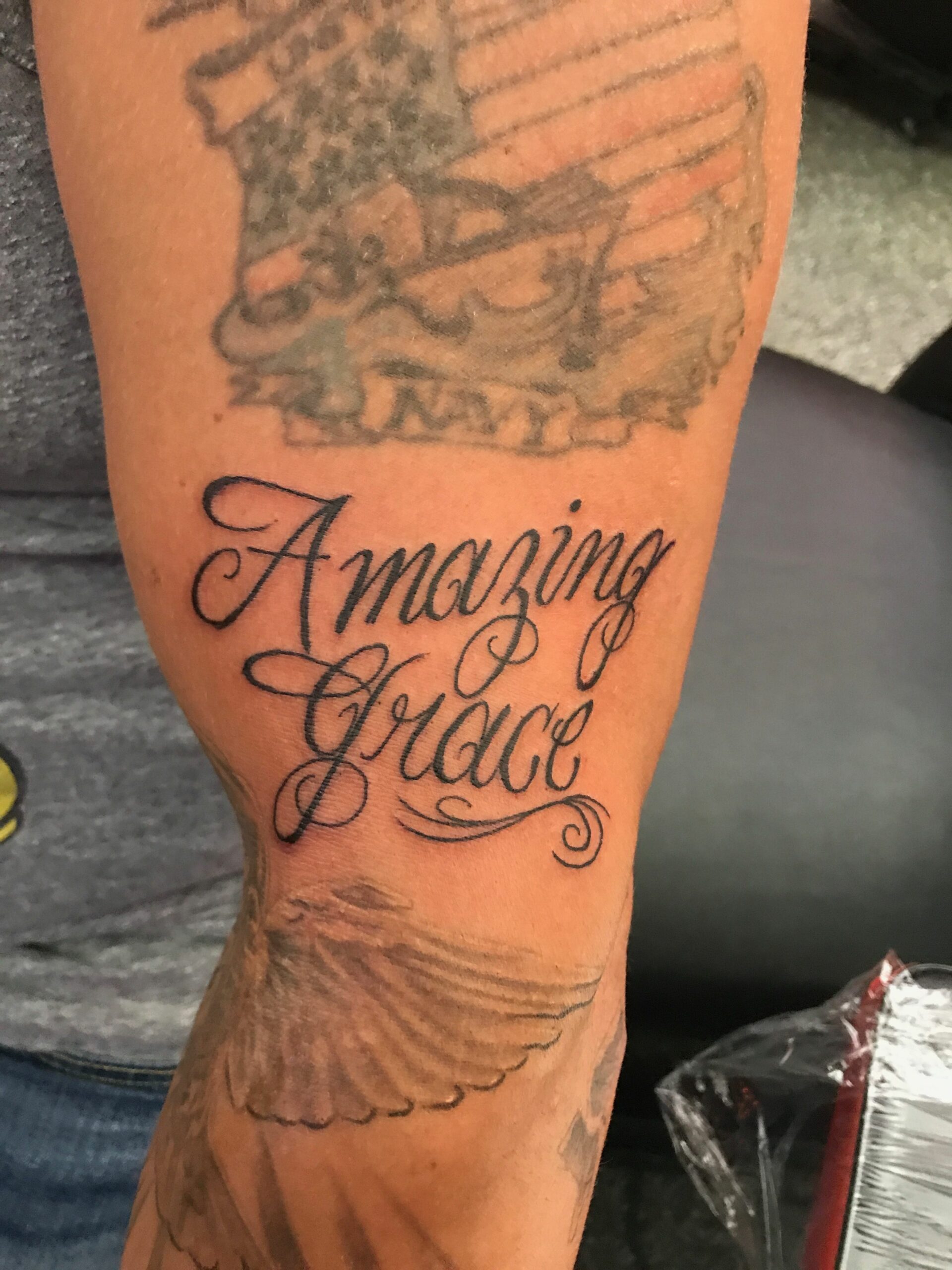Amazing Grace cursive lettering tattoo
