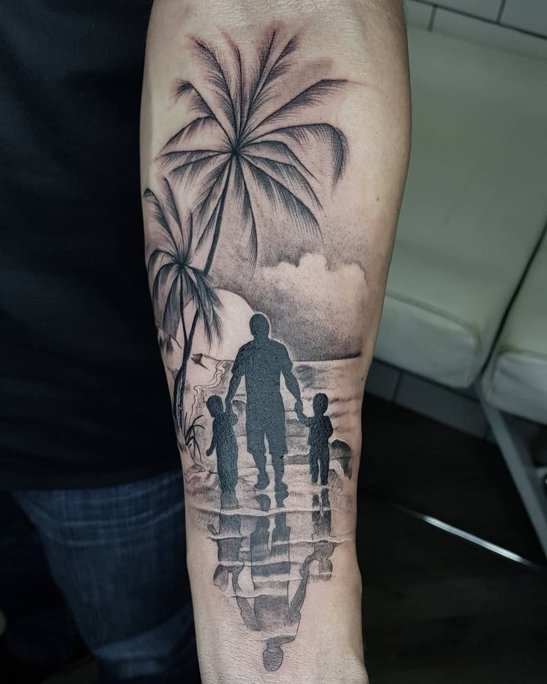 A Man's Arm with Family Reflection