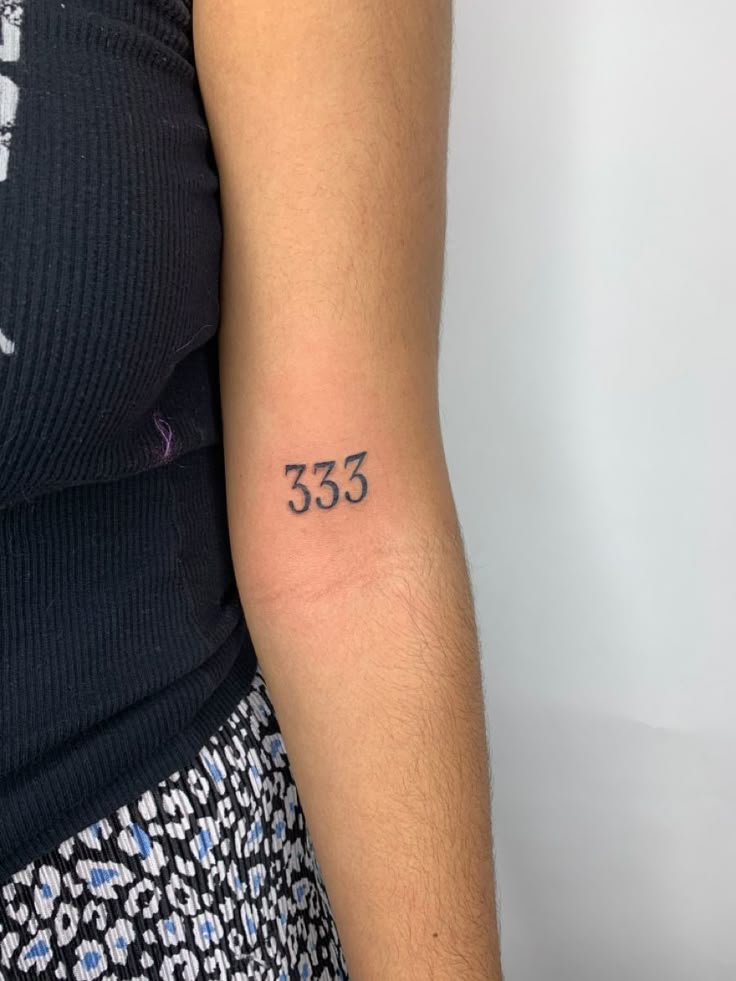 Number tattoo featuring the artistic representation of 333