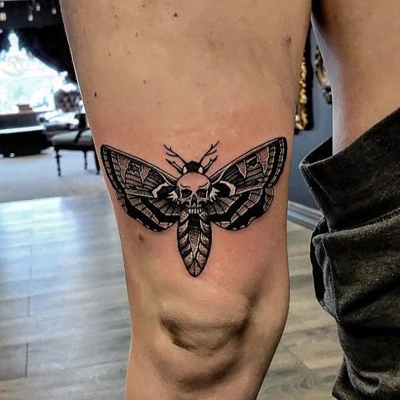 Tribal Symbol Above Knee Tattoo