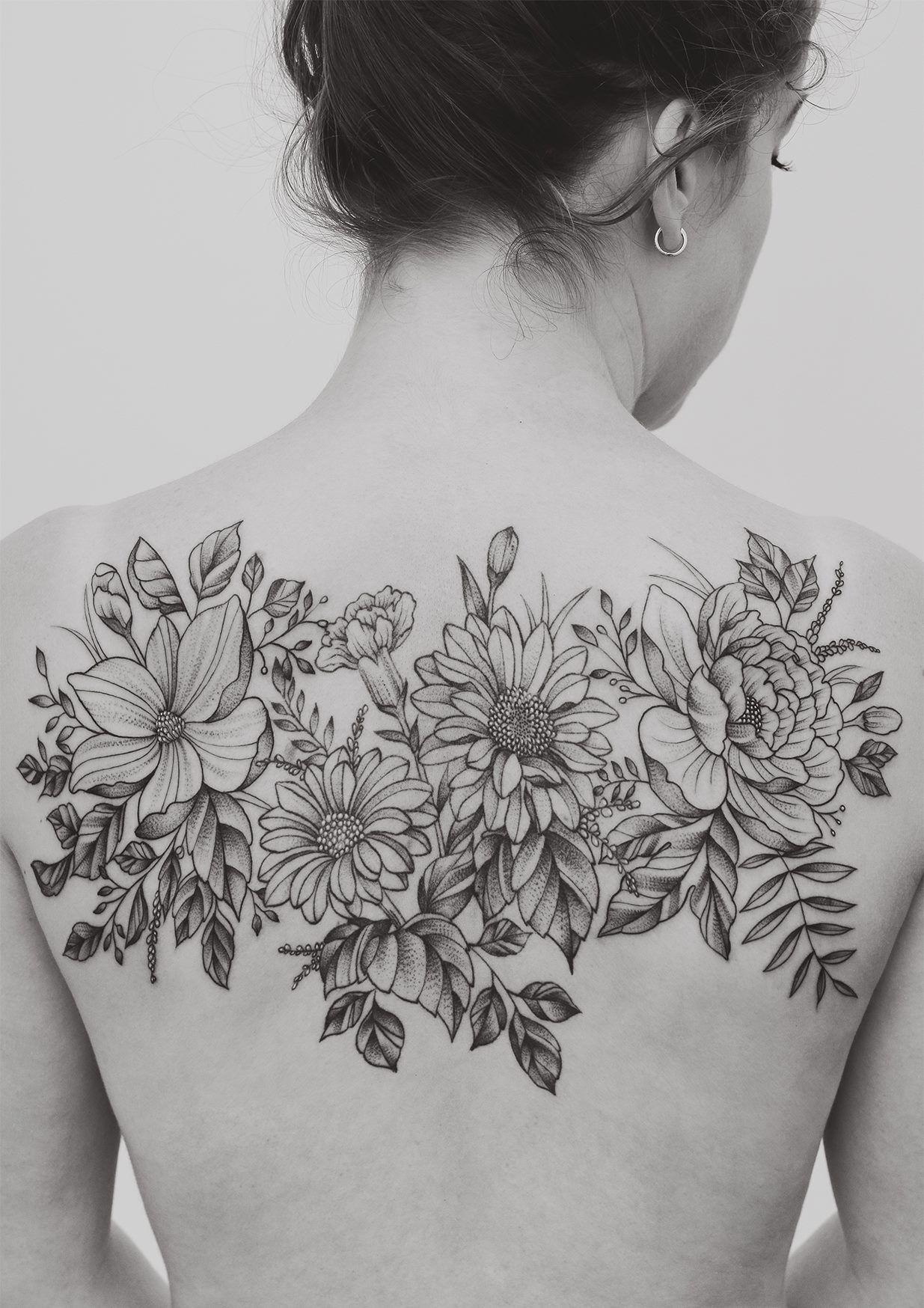 Delicate Floral Back Tattoo