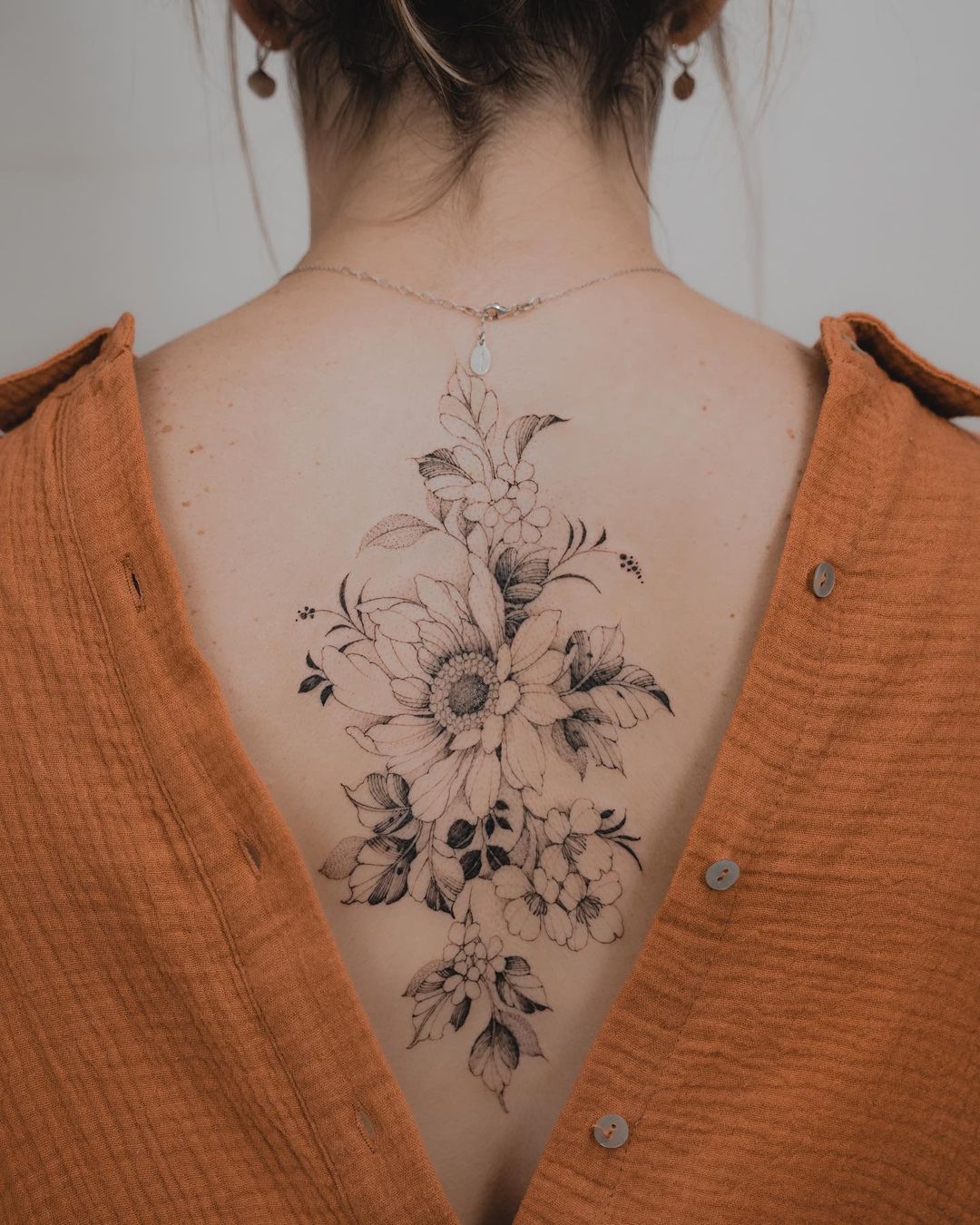Floral back tattoos