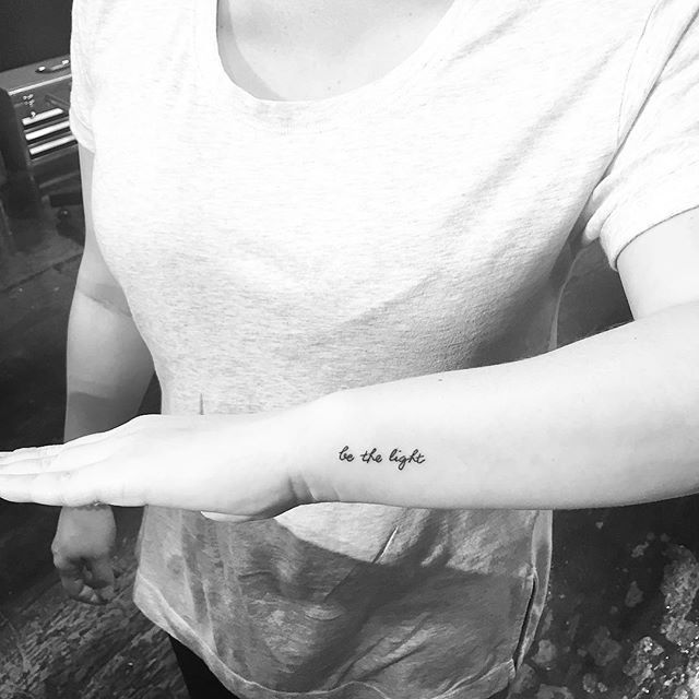 Bold statement 'Be the Light' tattoo