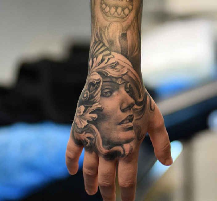 Tattoo 3D angel face on Hand - Ideas Tattoo Designs