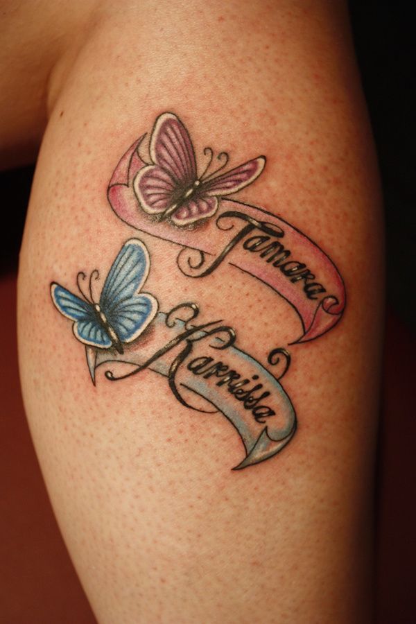 Name tattoo intertwined with floral designs