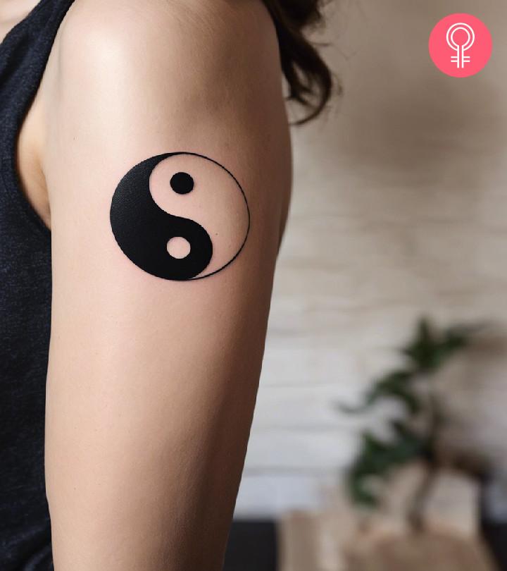 A balance tattoo on a woman's arm