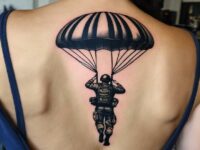 Airborne-tattoo-on-the-upper-back-of-a-woman