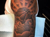 Basketball-tattoo-with-clouds-arm-tattoo