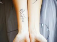 Girl-with-a-balloon-tattoo-on-the-forearms