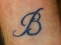 Letter-B-tattoo-13-on-forearm