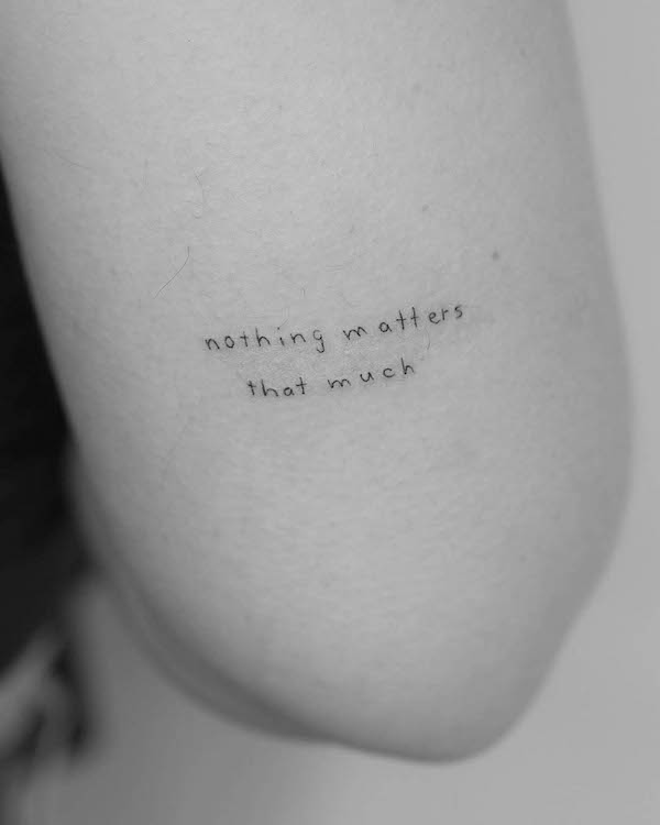 Meaningful quote tattoo above elbow