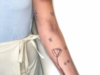 Minimalistic-Arm-Lift-Scars-Cover-Up-Tattoo-Design
