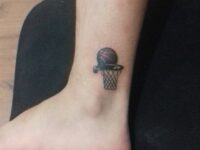 Small-basket-and-ball-tattoo-on-the-ankle