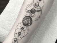 abstract-solar-system-planets-astronomy-tattoo-idea-on-forearm