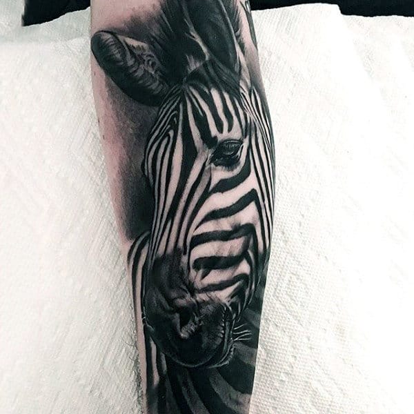 Black and white ink male zebra animal tattoo sleeve on lower forearm