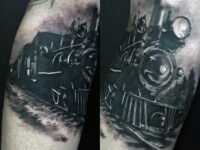 black-ink-steaming-train-tattoo-for-men