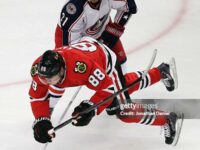 chicago-il-patrick-kane-of-the-chicago-blackhawks-is-tripped-by-james-wisniewski-of-the