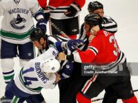 chicago-referees-try-to-break-up-a-first-period-fight-between-dustin-byfuglien-of-the-chicago