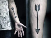 classic-arrow-blackwork-mens-archery-tattoo-design-on-inner-forearm