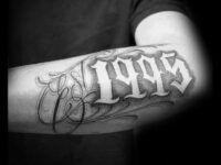 cool-1995-negative-space-guys-est-outer-forearm-tattoo