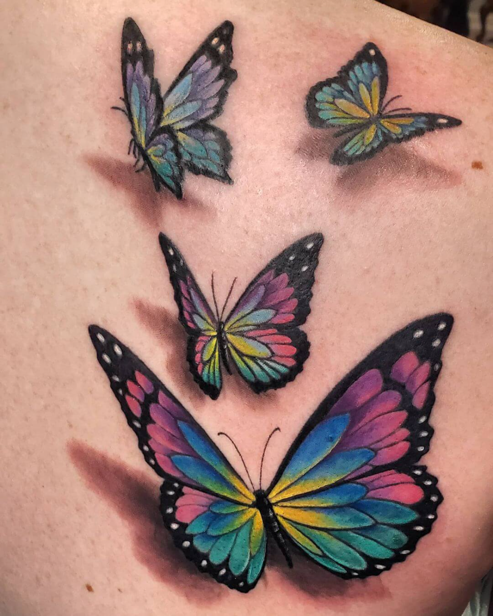 Vibrant 3D butterfly tattoo showcasing transformation