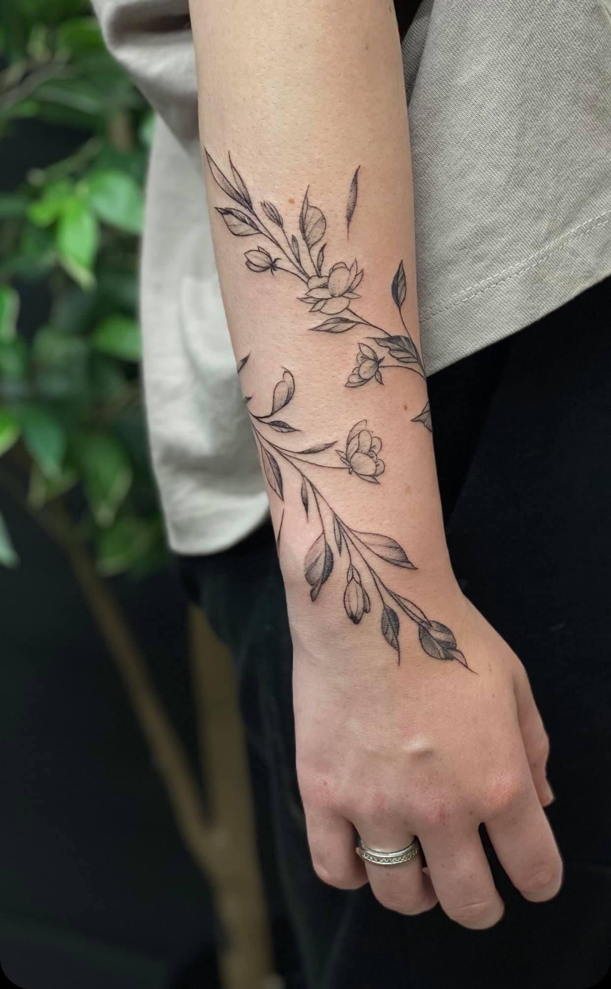 Nature-Inspired Arm Wrap Tattoo