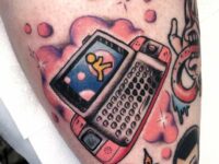 early-2000s-sidekick-tattoo-done-by-seth-rogers-at-burke-st-v0-sv9wbp3pdwec1