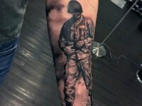 forearm-sleeve-male-tattoo-of-shaded-black-and-grey-ink-army-solider