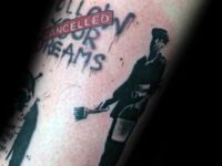 guys-banksy-follow-your-dreams-arm-tattoo