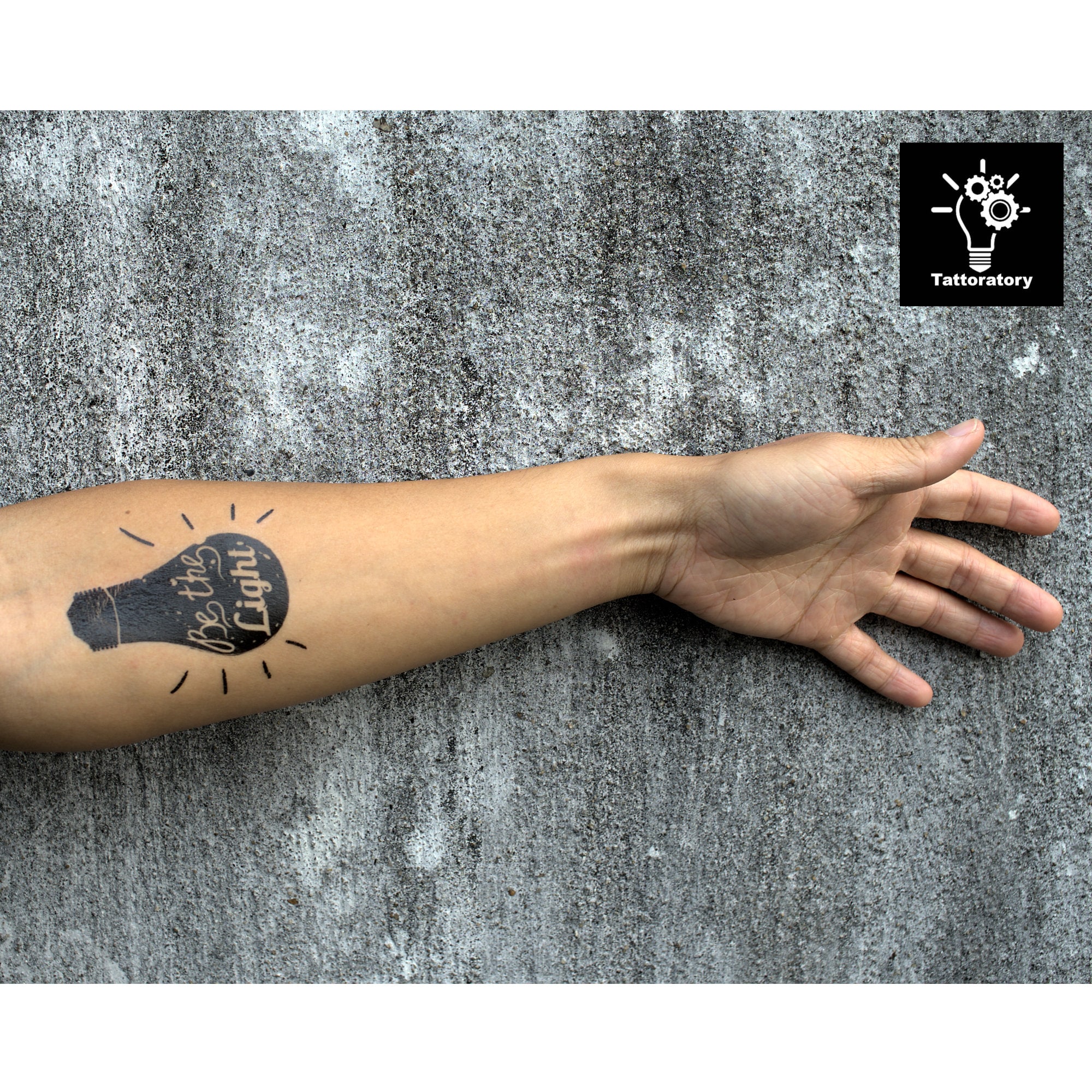 Artistic 'Be the Light' tattoo