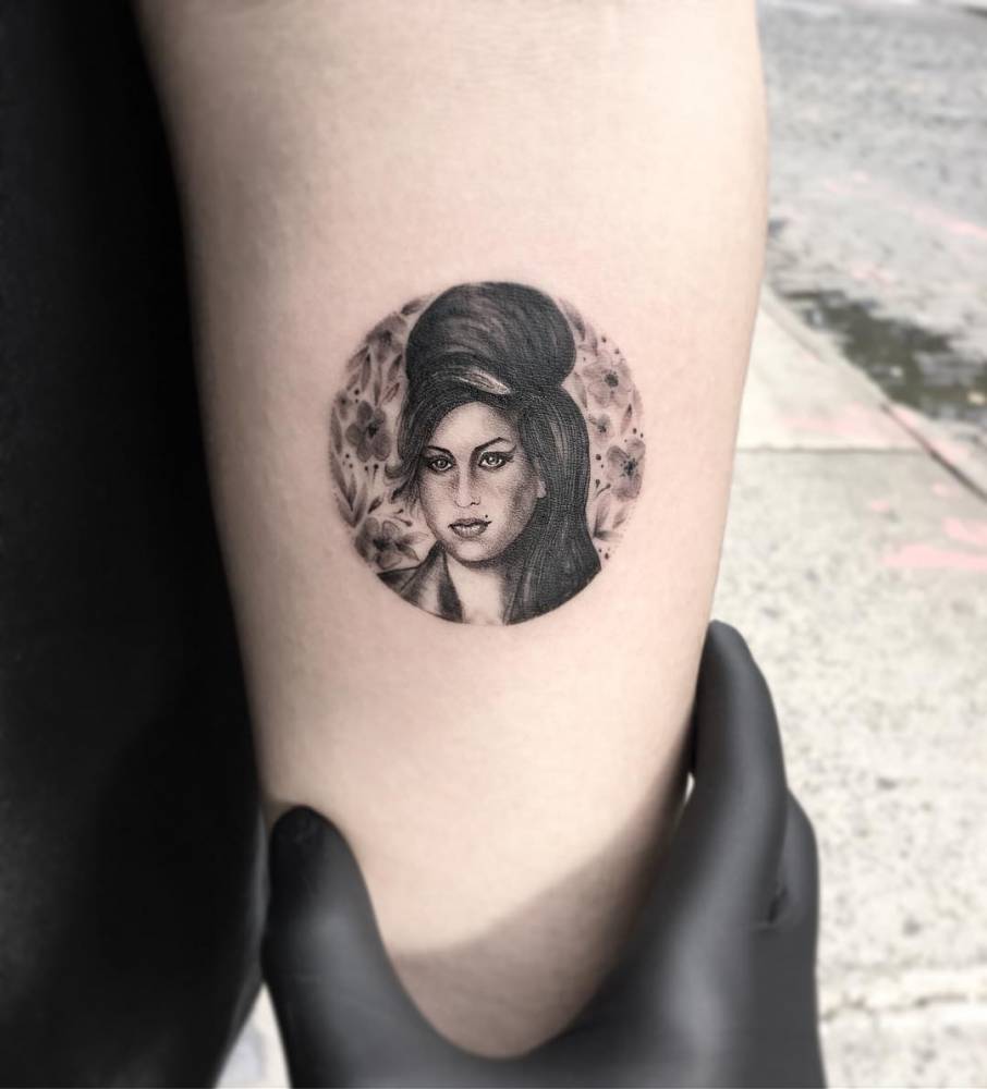 Amy Winehouse circle portrait tattoo