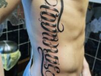 mens-rib-cage-side-ambigram-tattoos
