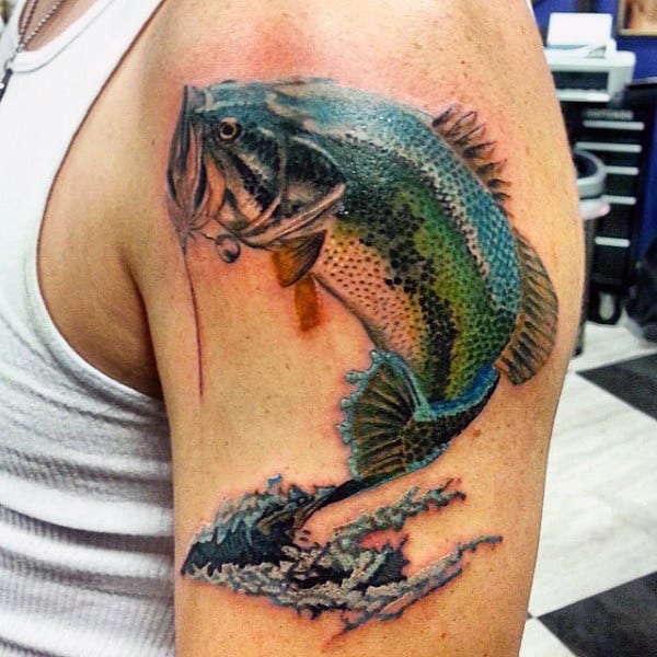 Stylish jumping bass tattoo on male bicep.
